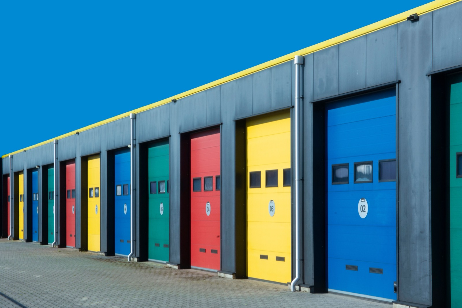 Row of numbered units in a multi-tenant small-bay industrial park